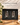 Two stemless wine glasses held in fitted charcoal foam inside a black magnetic gift box.