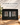 Two rocks glasses and four displayed stones in fitted foam inside a black magnetic gift box.