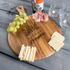 Wood Charcuterie Board with a handle on a table. The engraving design is centered on the board. The design is of a bouquet of flowers and beneath it is "Alex" and beneath that is "& Madeline" and beneath that is "Livingston". So, three lines of text: first name, send name and a last name.