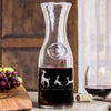 Etched wine decanter glass. The etching wraps around the glass. The design is of a family of deer lined in a row. There is a dad deer, mom deer and three kids. Under each deer has a printed name "Dad, Mama, Jameson, Anya, Brian". Deer can be added or taken away.