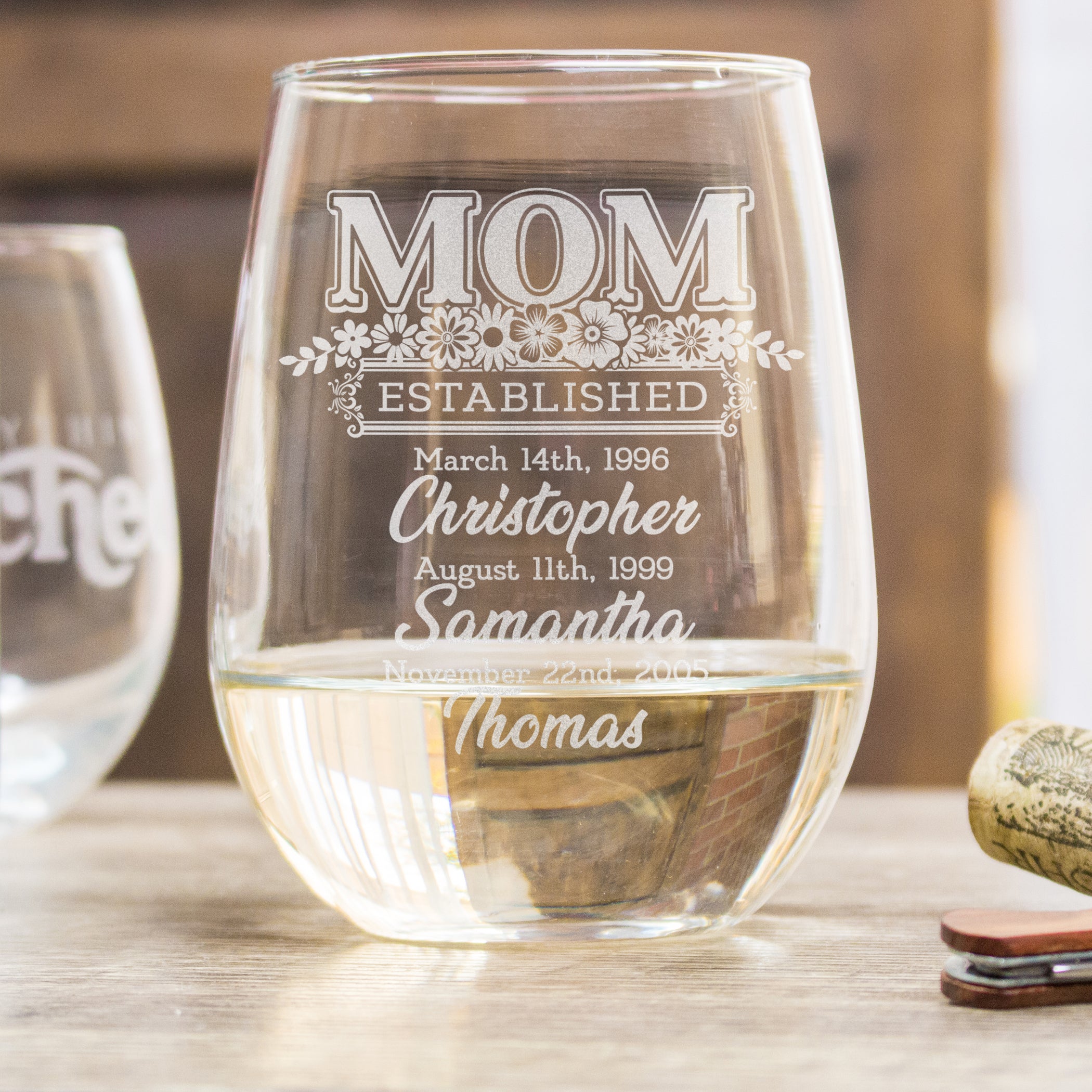 Stemless wine glass engraved with Mom Established and children's names and birthdates.
